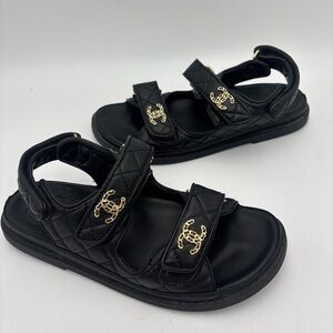 CHANEL Quilted Black Sandals with Gold Logos